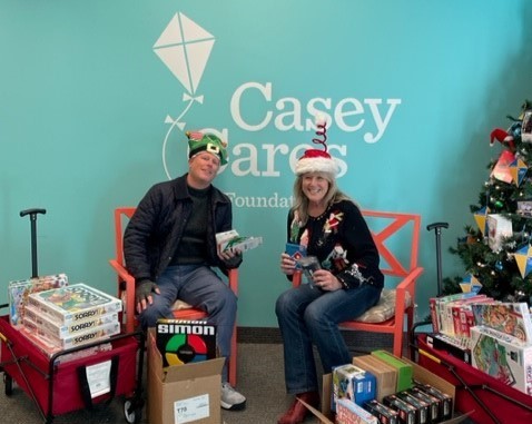 PMG employees delivering gifts to Casey Cares