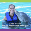 Kylie Martin smiles with a dolphin, highlighting her role as Senior Production Manager at PMG. Welcoming her to Nonprofit Direct Mail Production.