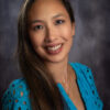 Professional headshot of smiling woman, Jade Nguyen Swanson.